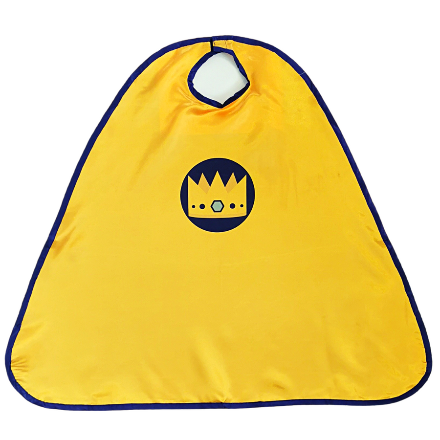 The Little Ballet Dancer cape. Golden yellow with dark purple/blue trim and the Little Ballet Dancer crown logo in the centre. Flat lay photo